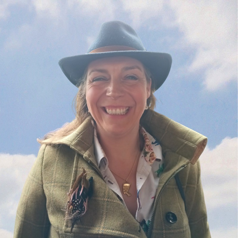 Laura Broadway, white woman with a hat on